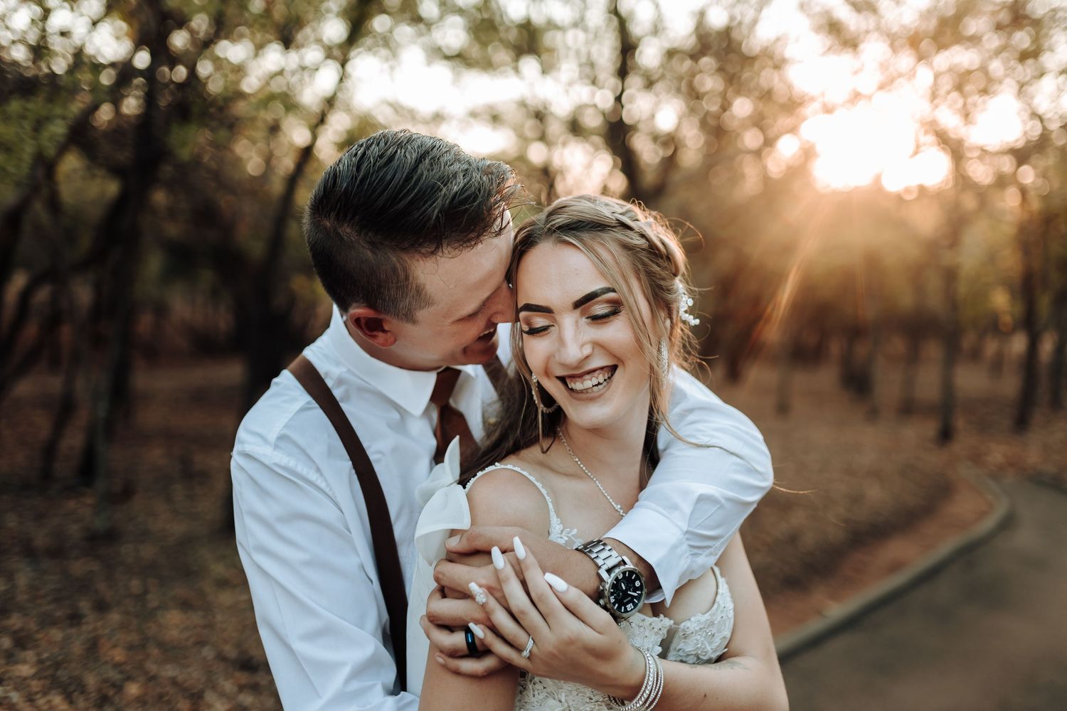 Sunset wedding photography showing tender moments between newlyweds.