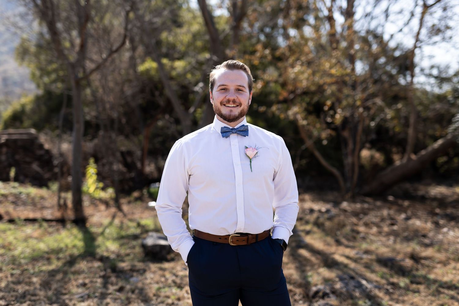 Group of outdoor groom portraits showing a man in formal attire posing in various natural settings with sunlit trees.