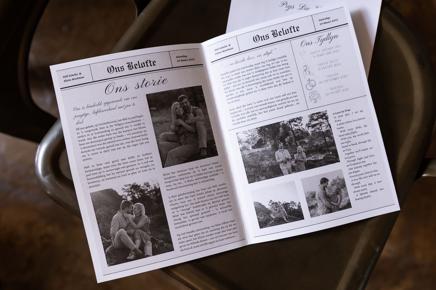 Wedding newspaper program showing black and white photos and text layout on wooden surface.