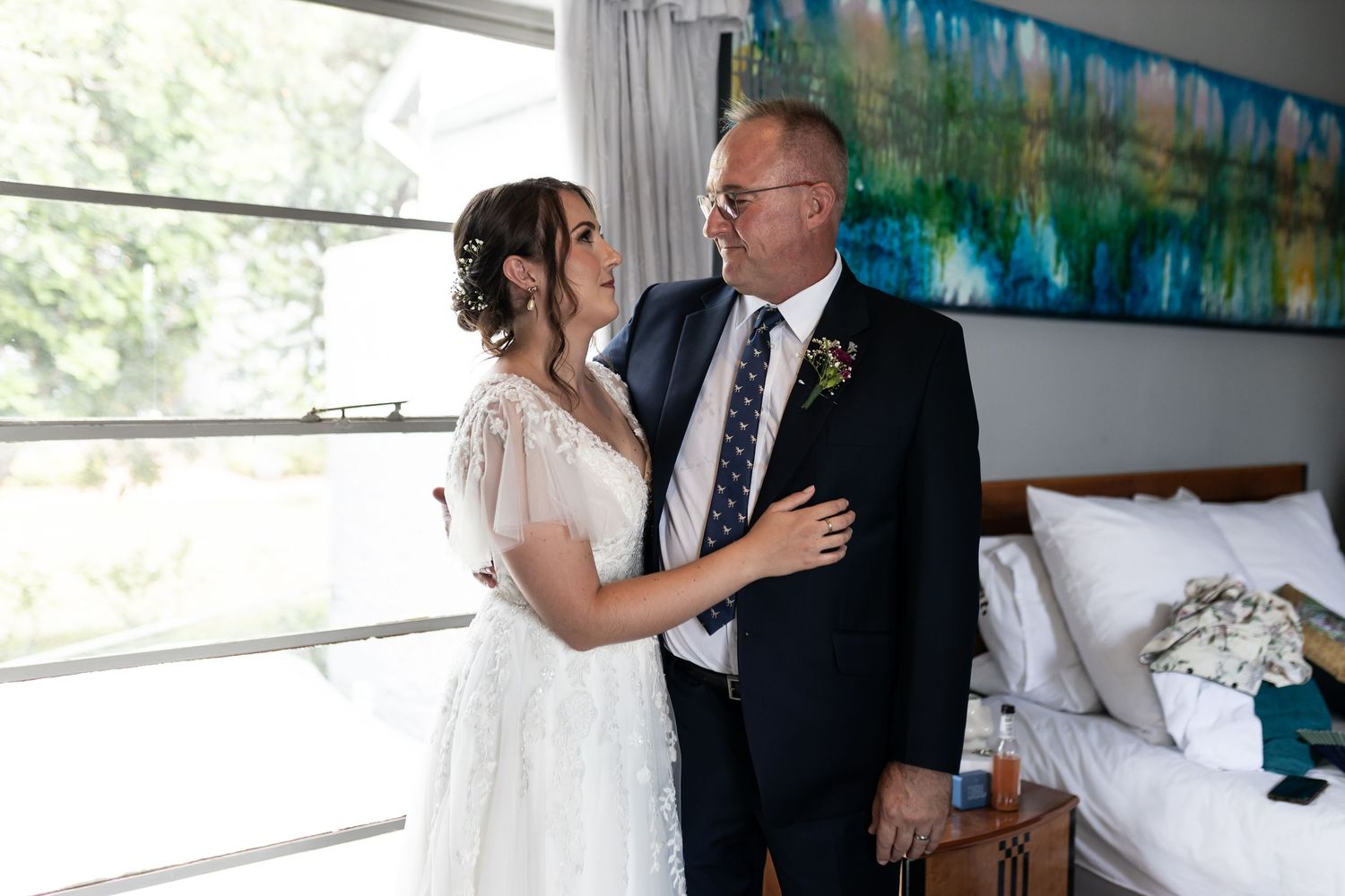 A tender moment shared between two people during a wedding celebration.