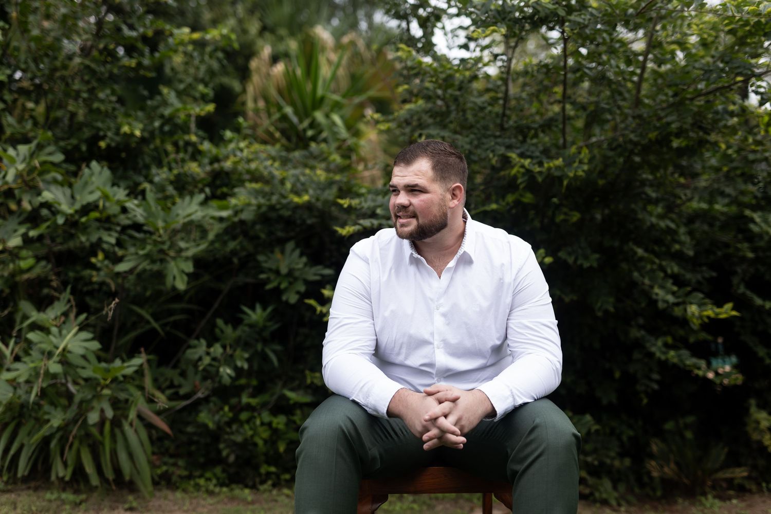 Garden portrait in natural setting with greenery background.