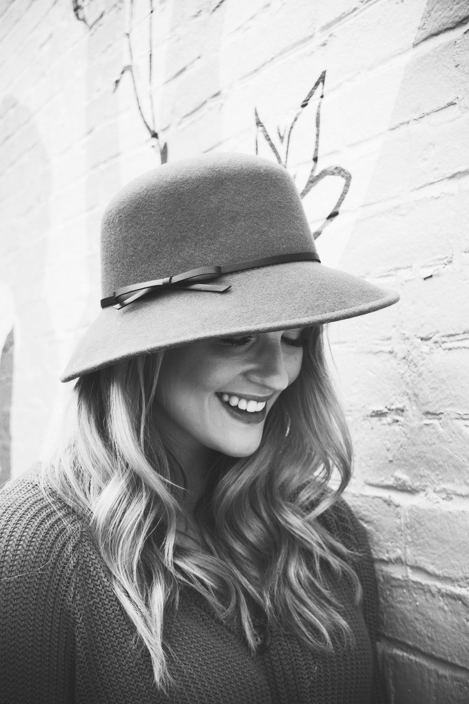 Black and white lifestyle session, model with hat. Contact Robinson Photography to create your own custom session.