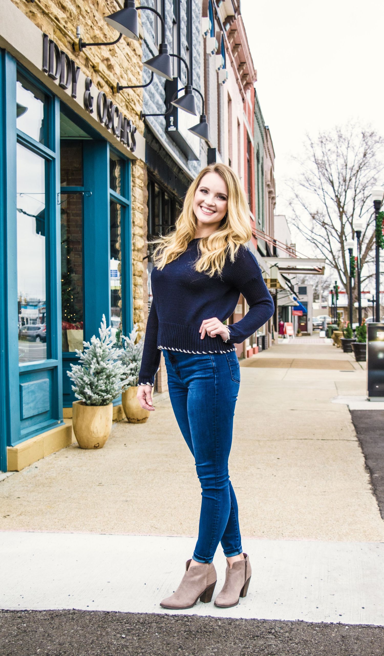 Blonde model pauses for a photo before shopping local. Contact Robinson Photography to create your own custom experience.