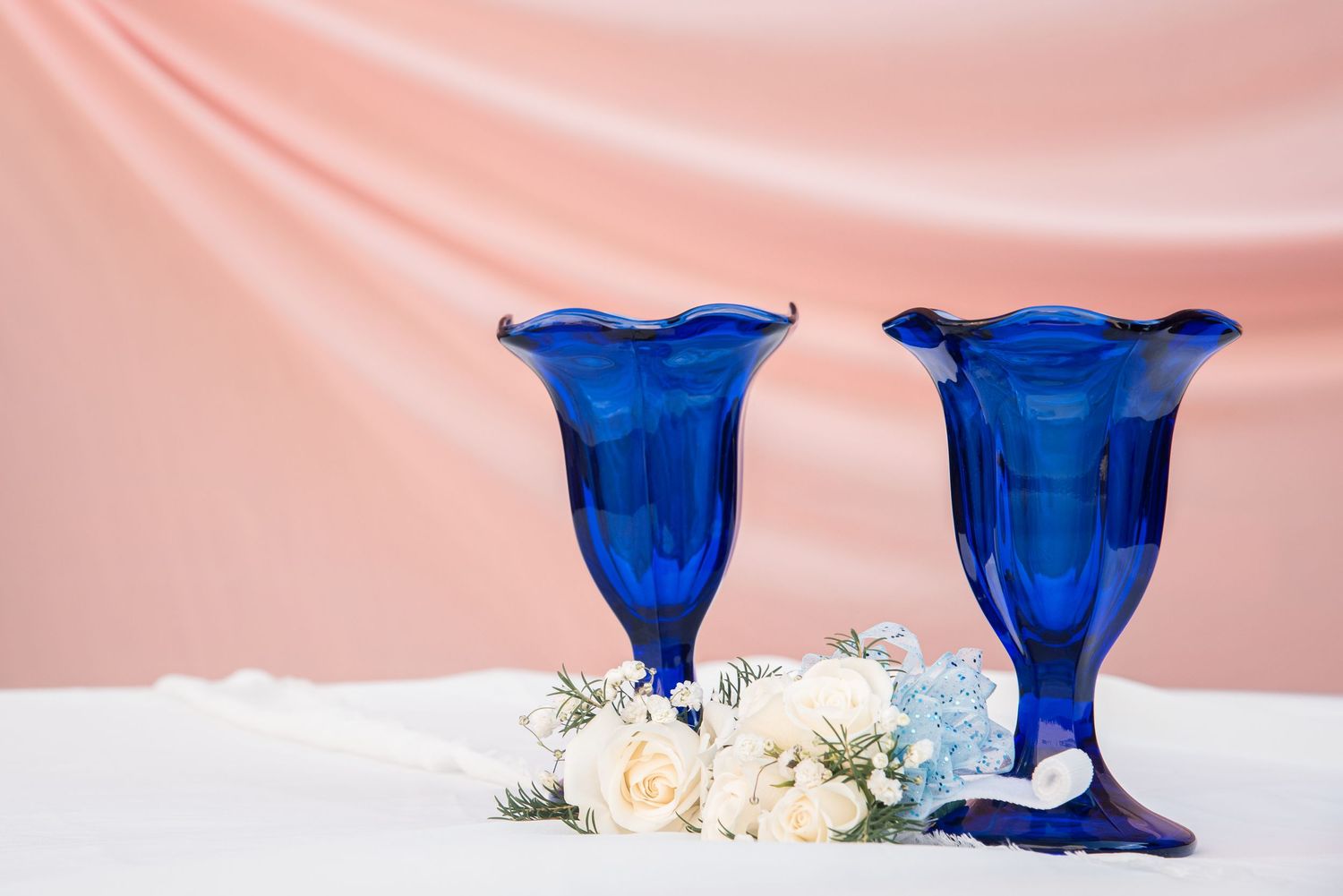 Detail photos, like these blue dessert glasses & corsage, are vital in sharing your prom story. Connect with us today