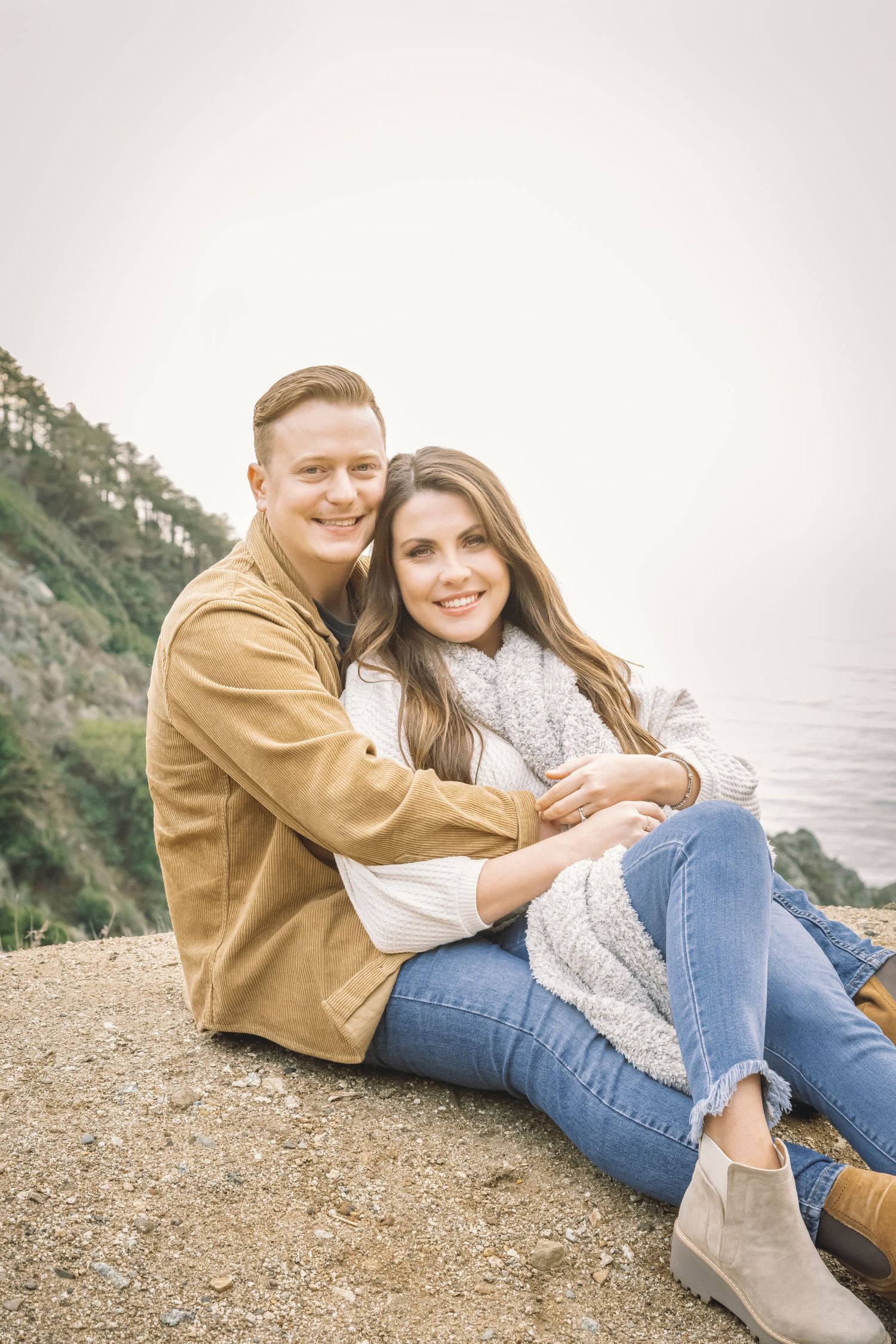 Big Sur, California couple relax on the Pacific Coast.