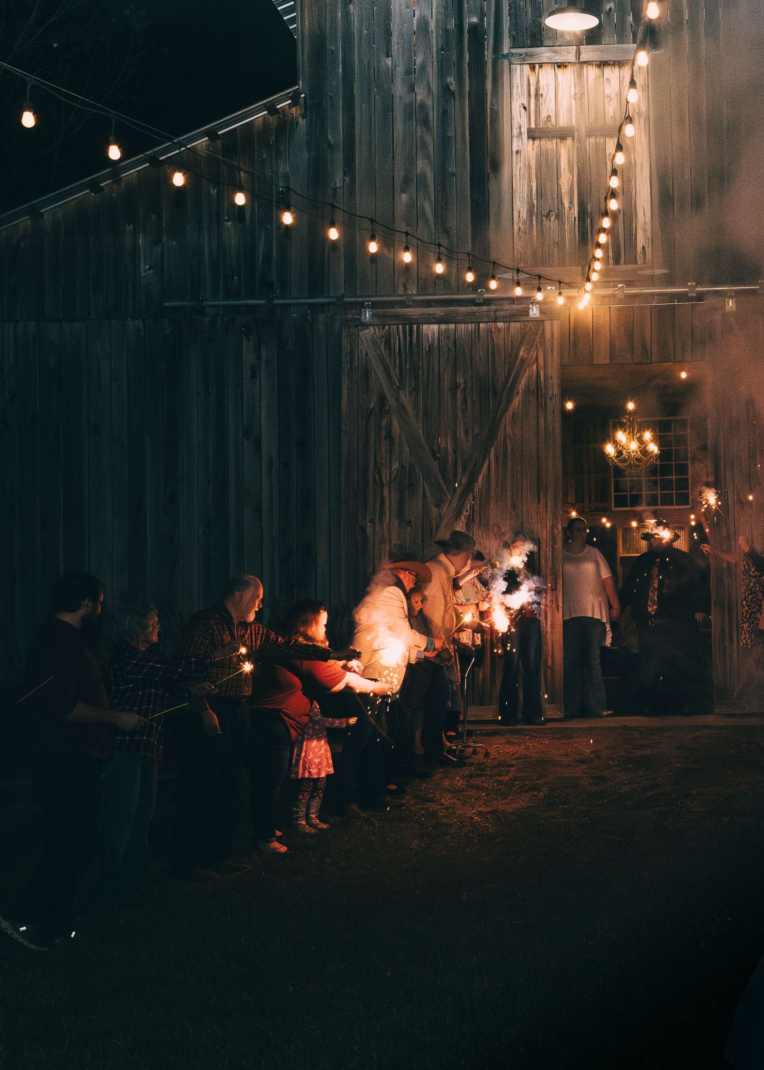 Sparkler Exit at this beautiful country barn, lights the way for the bride and groom to celebrate their end of night, wedding night.