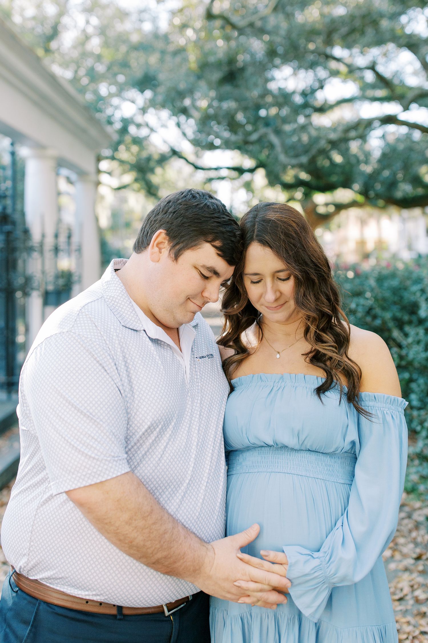 A series of romantic poses captured in a garden setting with natural lighting and greenery.