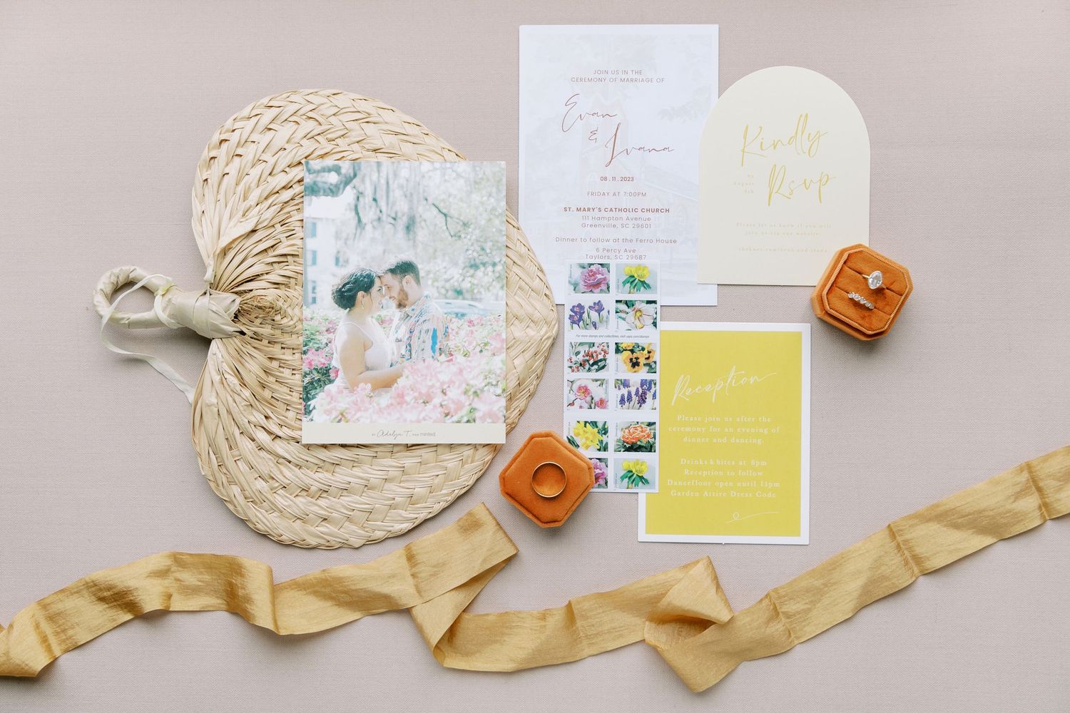 A collection of paper cards, art supplies, and crafting materials laid out on a light surface.