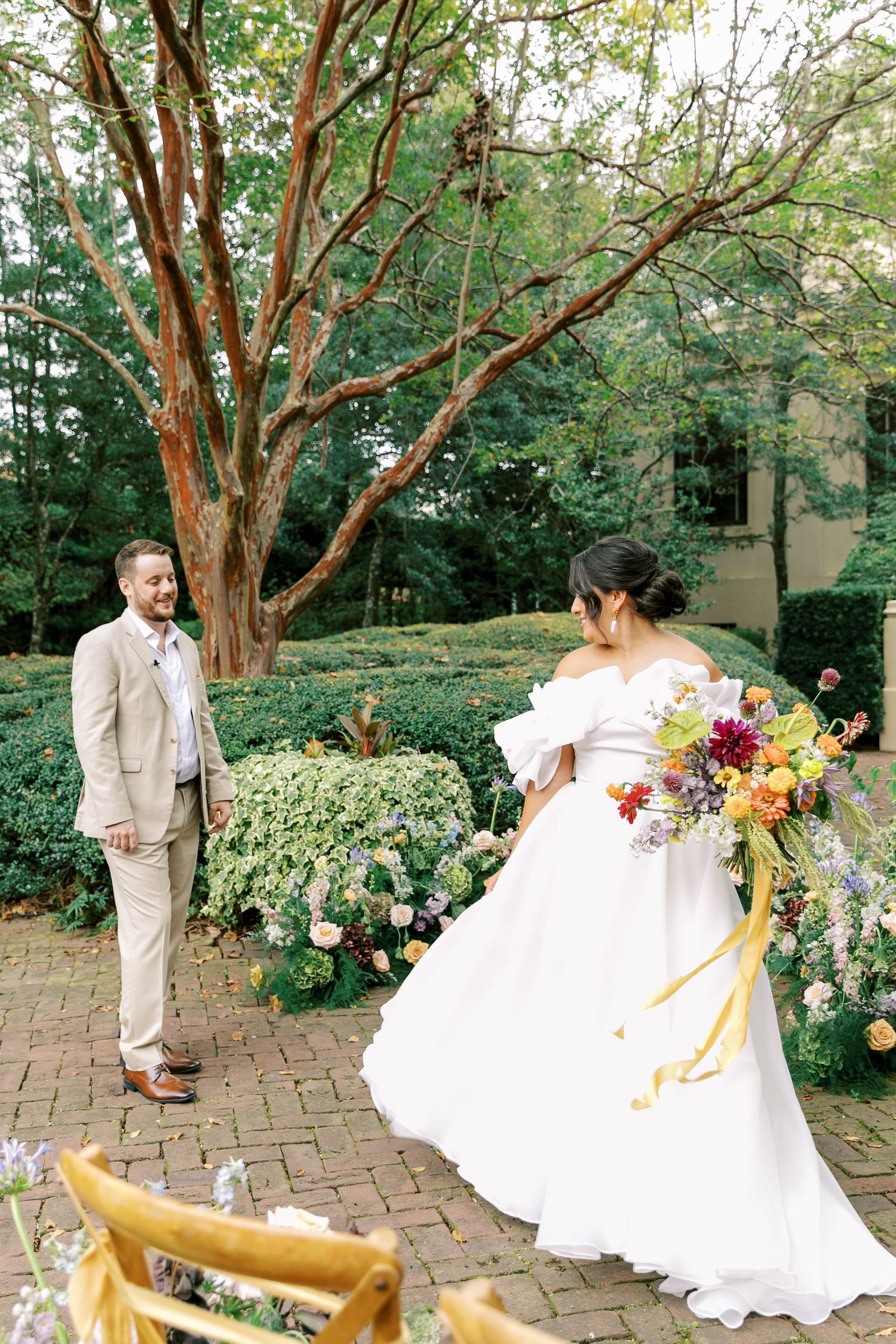 A sequence showing a wedding couple in a garden setting with beautiful brick pathways and greenery.