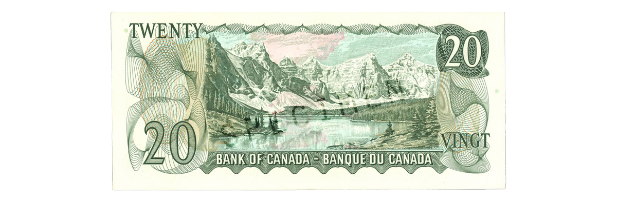 Vintage Canadian 20 dollar bill featuring mountain landscape scene.