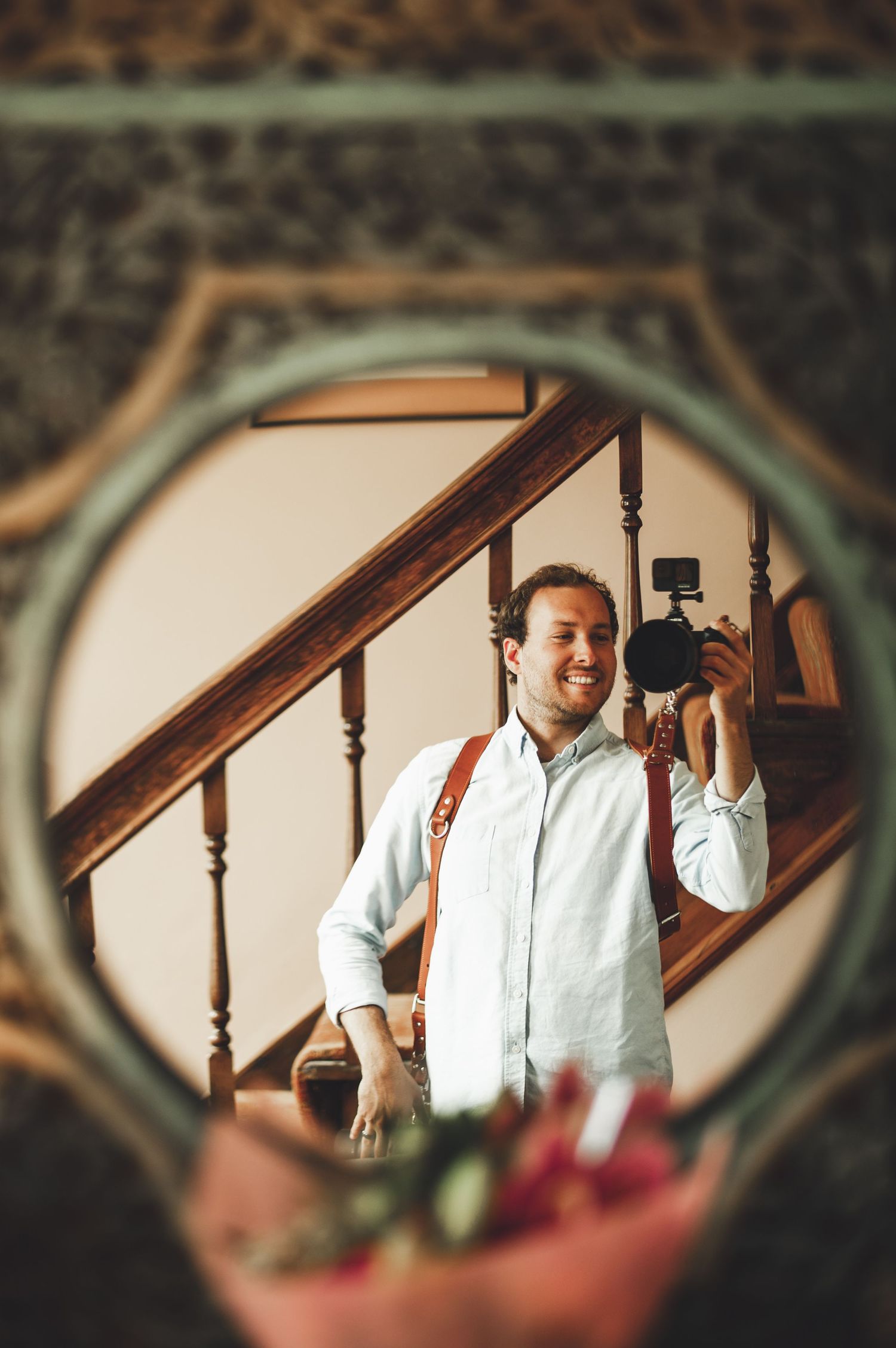 Photographer AFP photography. Mirror reflection shows wedding day preparations with white formal attire.
