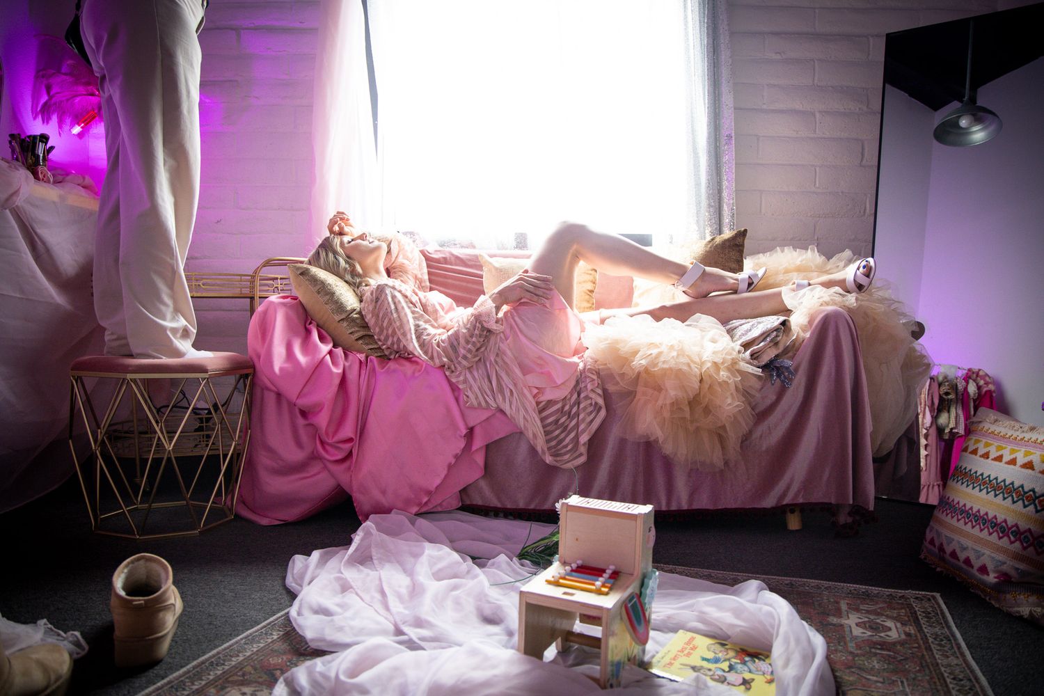 Mother in pink getting ready at Denver Photo Collective for Mother's Day