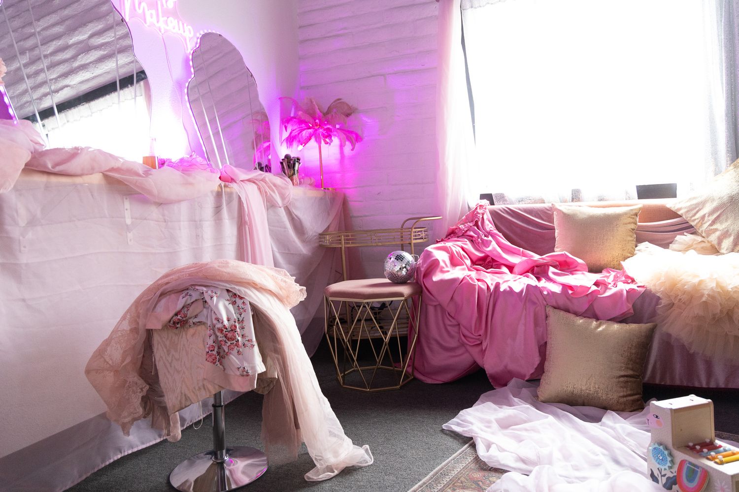 Mother in pink getting ready at Denver Photo Collective for Mother's Day