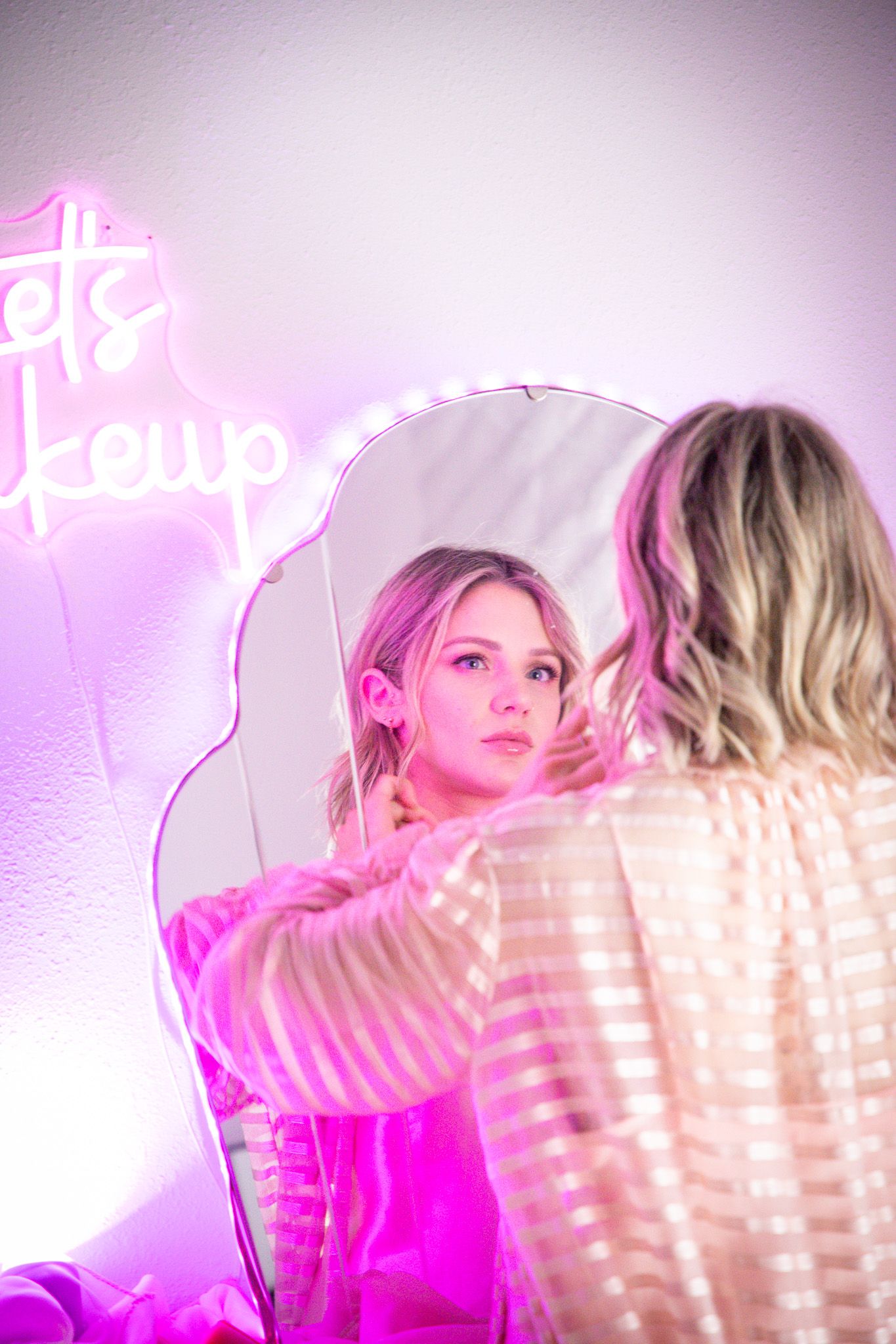 Mother in pink getting ready at Denver Photo Collective for Mother's Day