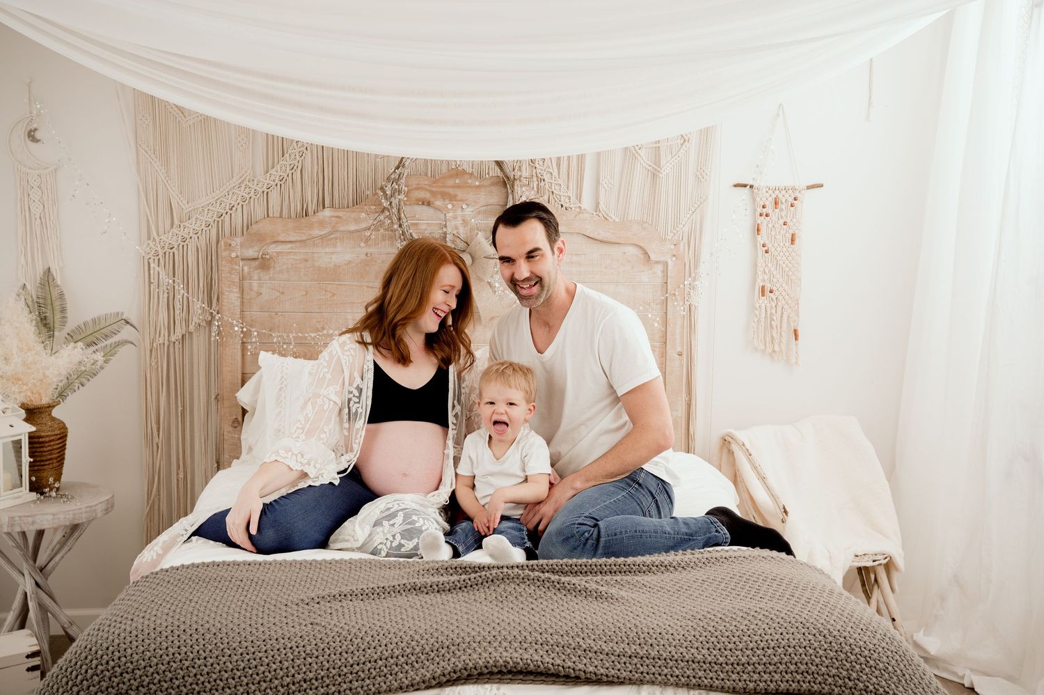 Three candid moments show a family relaxing together on a white bed in a bright, sunlit bedroom.