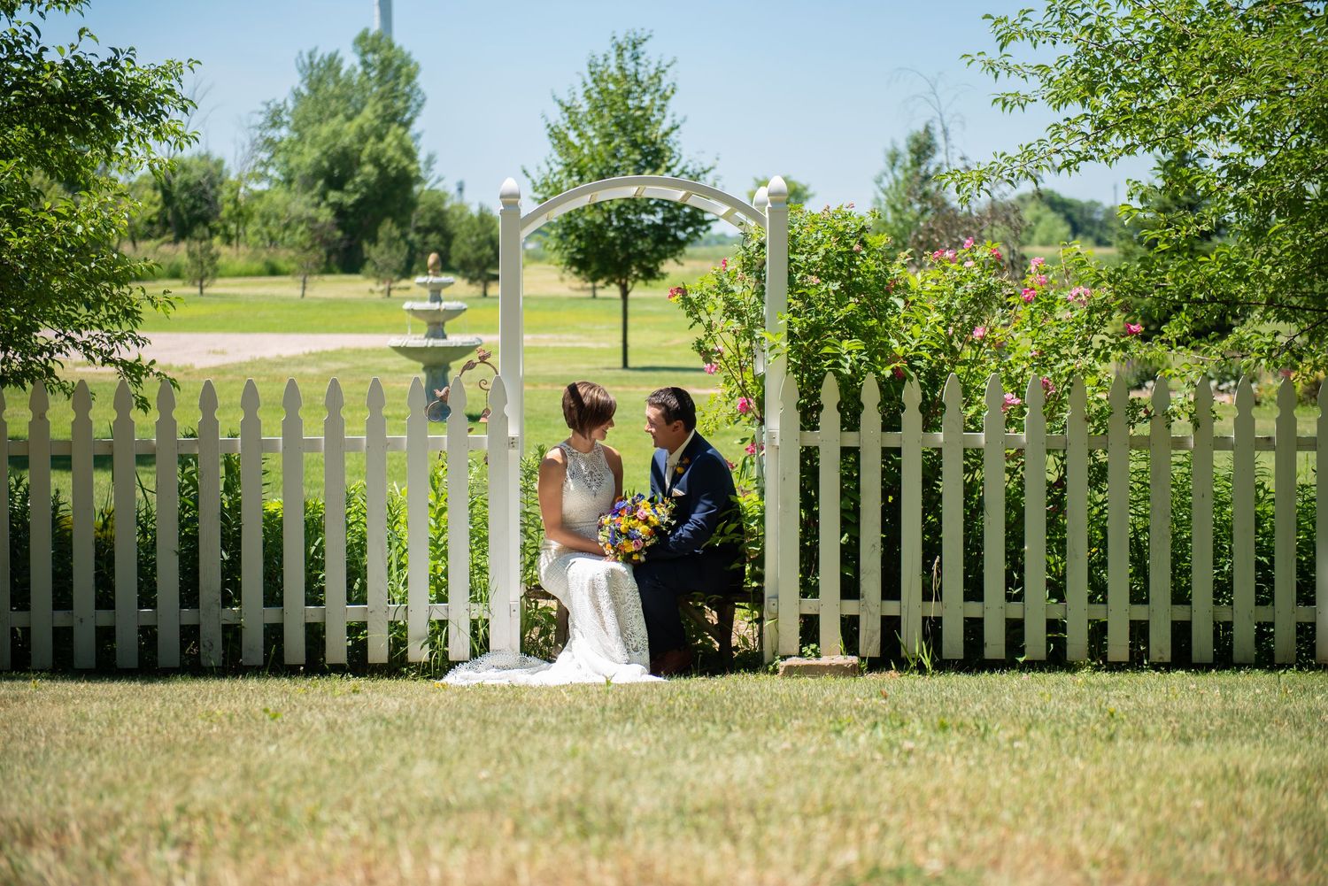 A sequence of wedding ceremony photos showing couples at different moments against a white picket fence backdrop.