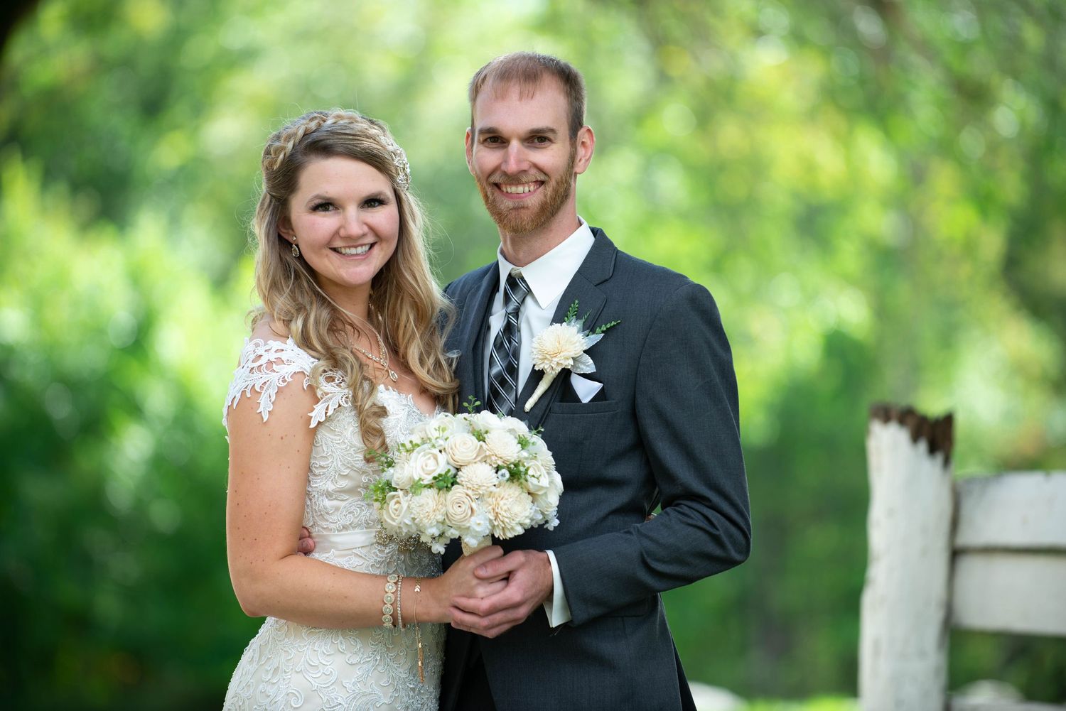 Wedding couple portraits in a garden setting with natural sunlight filtering through trees. Rum River Barn Milaca Minnesota Weddings