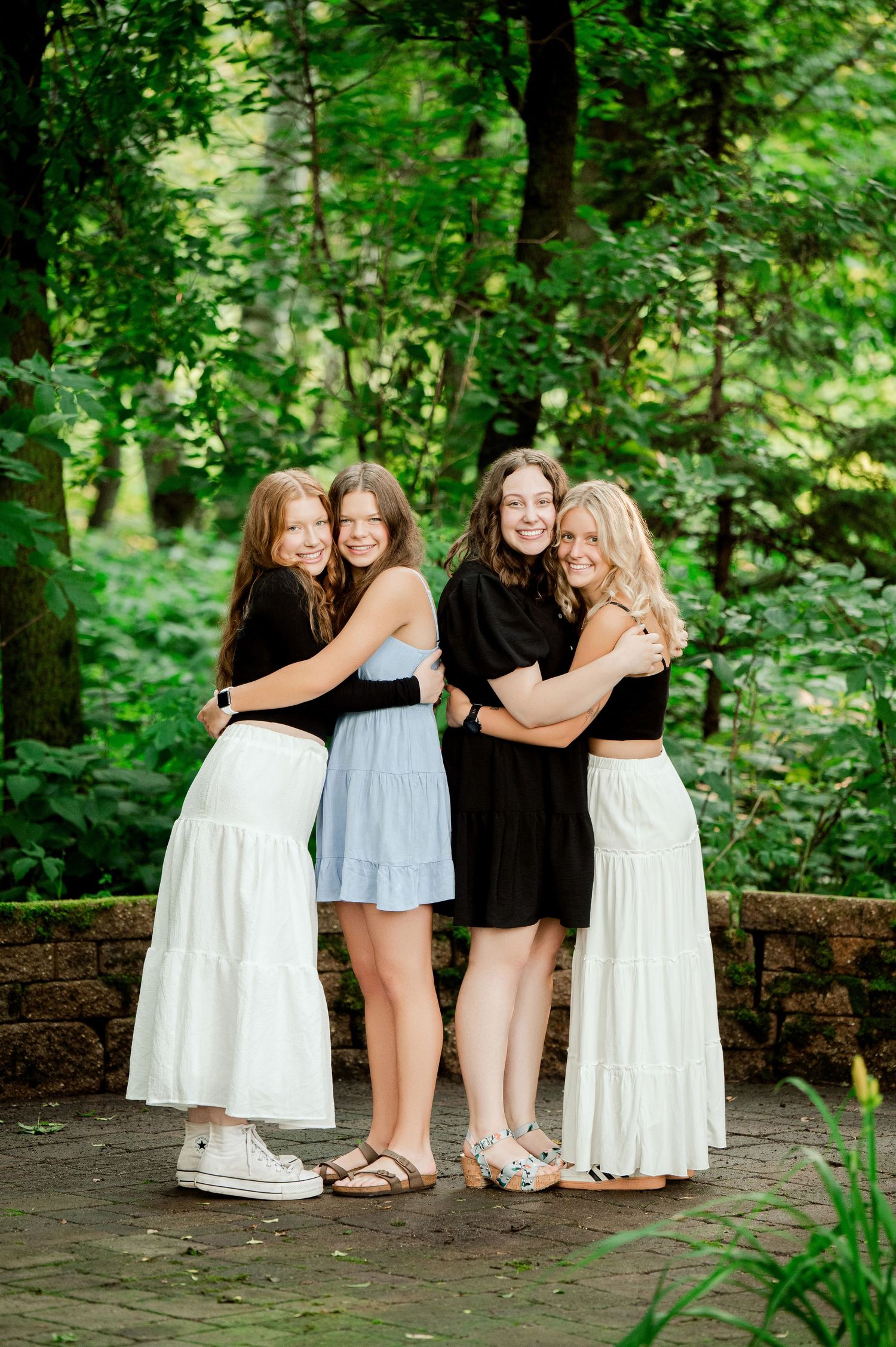 Clear Lake Family Photography: Group photo series of friends in white and black outfits posing together against natural forest backdrop.