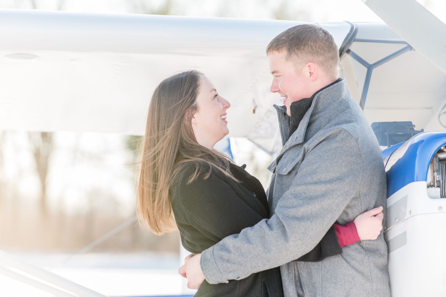 A series of romantic poses captured under an urban bridge structure with natural lighting.