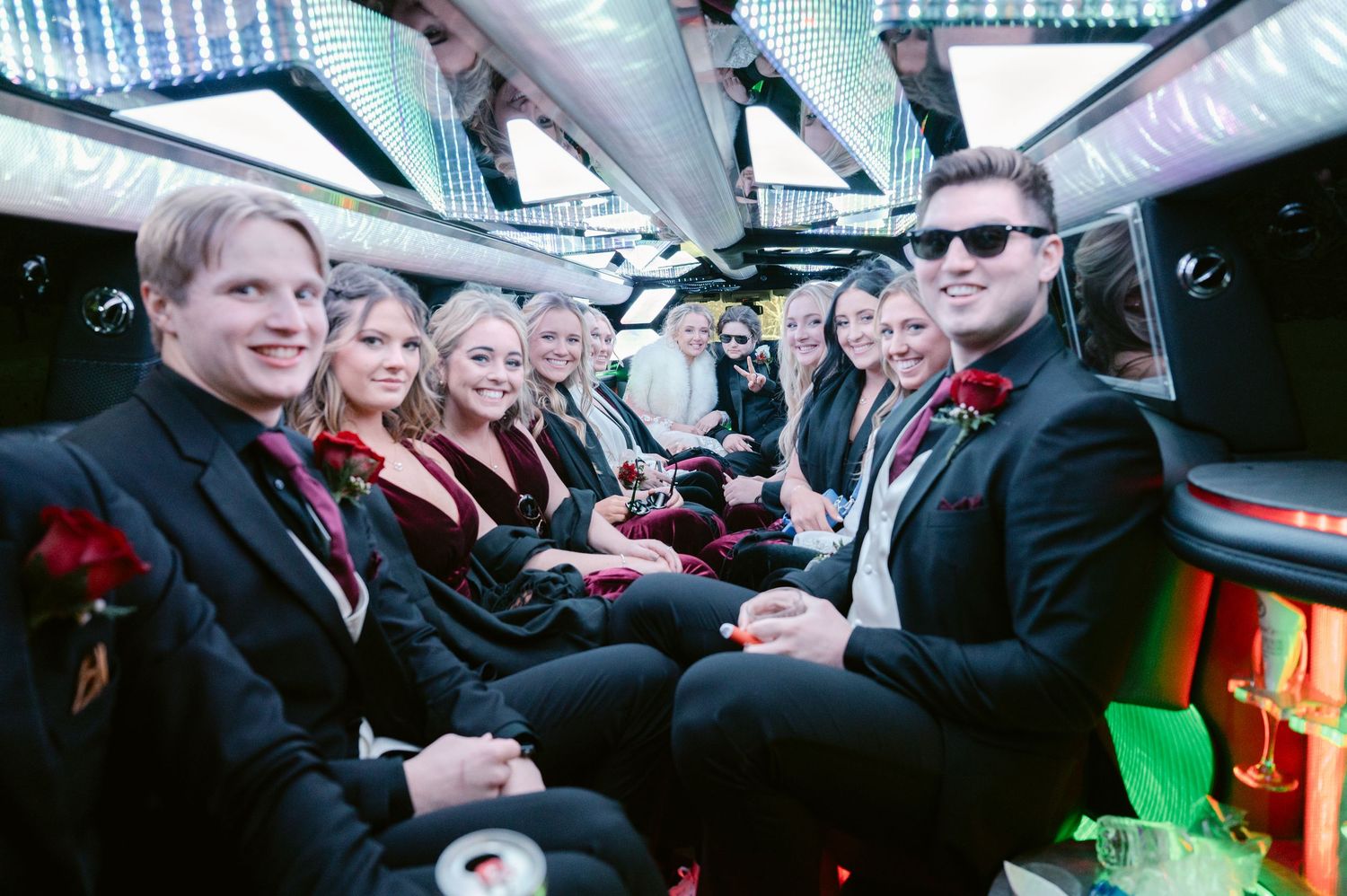 Wedding Party gathered together in a crowded limousine smiling in St Anthony Minnesota