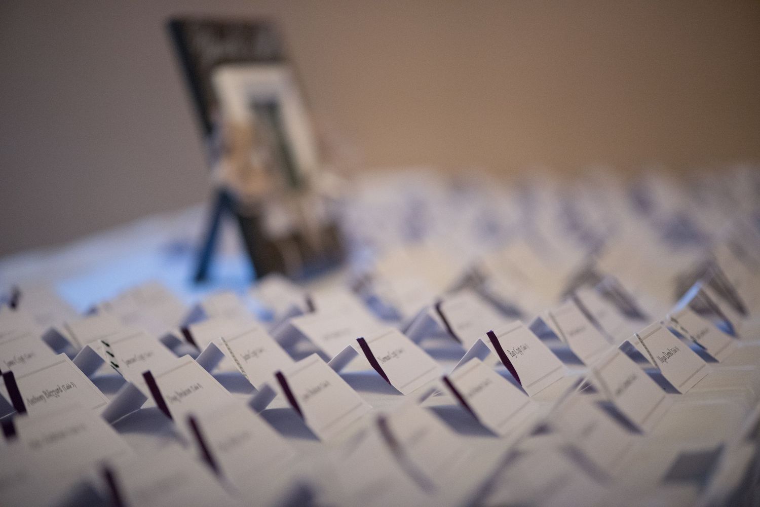 Close-up macro photograph of textured metallic keys or type strips arranged in a row. Andover wedding at Magestic Oaks Golf Club