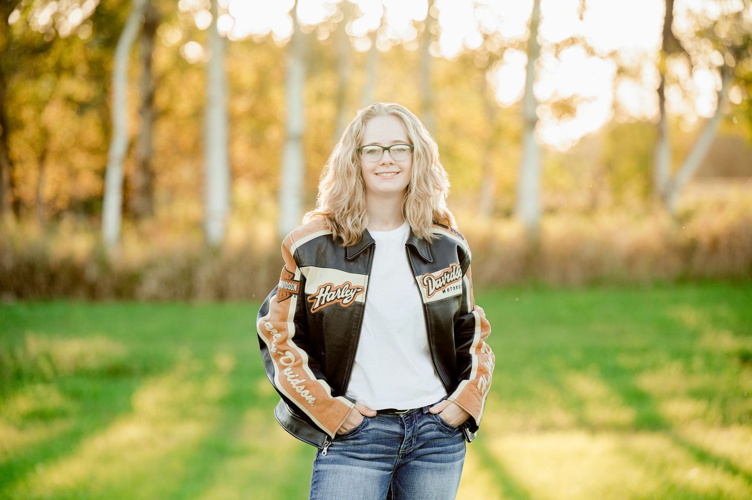 Senior Portrait in Foreston MN Golden hour outdoor portrait session with casual denim and bright sunny backdrop.