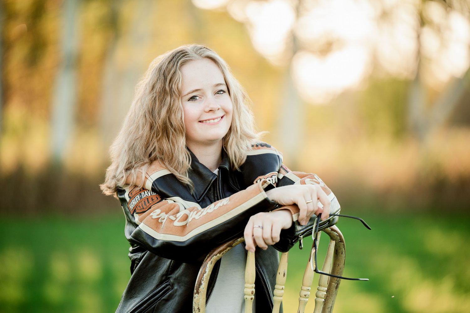 Senior Portrait in Foreston MN Golden hour outdoor portrait with natural lens flare and bokeh effects.