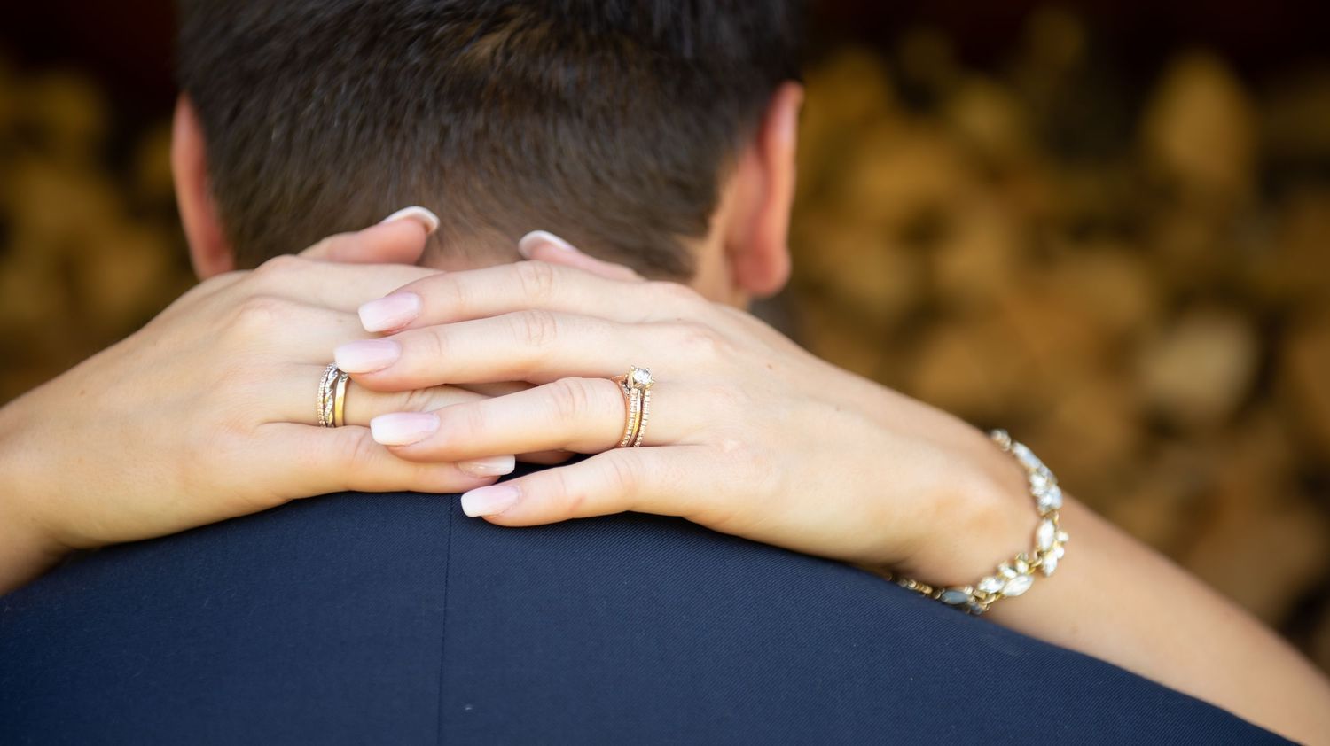 Close-up photo showing several hands clasped together illustrating unity and connection.