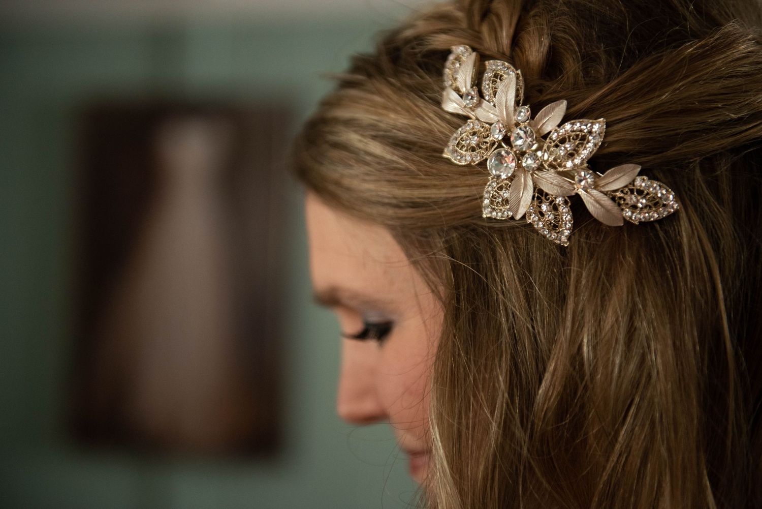 Close-up view of elegant crystal hair accessories and delicate bridal jewelry details. Rum River Barn Milaca Minnesota Weddings