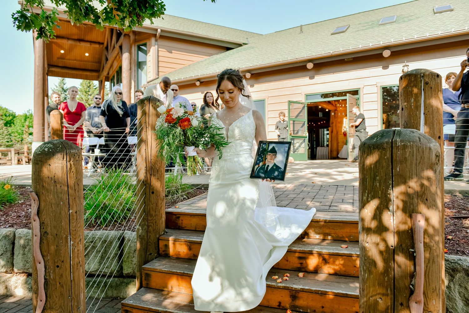 The Grands At Mulligans. A rustic outdoor wedding venue with wooden posts and folding chairs set up for a ceremony.