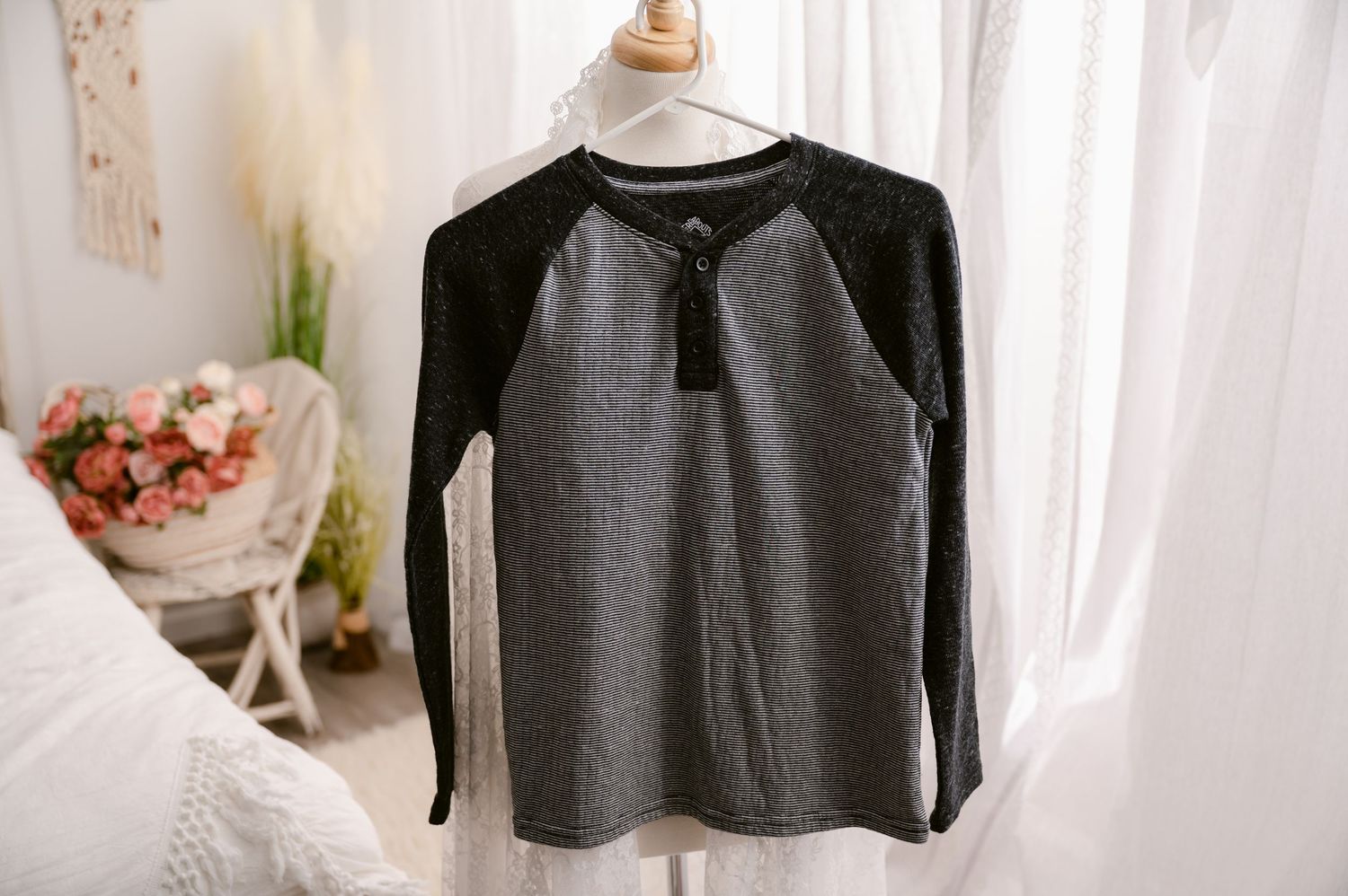 Gray and black raglan style long sleeve shirt with waffle texture displayed on white mannequin against light background.