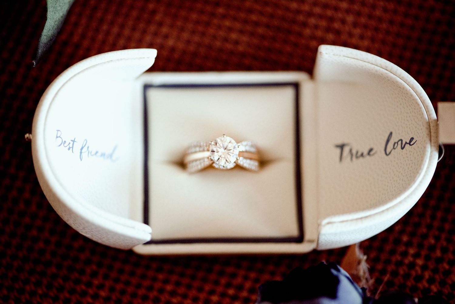 Pier B Duluth Wedding A sparkling diamond engagement ring nestled in a white ring box with