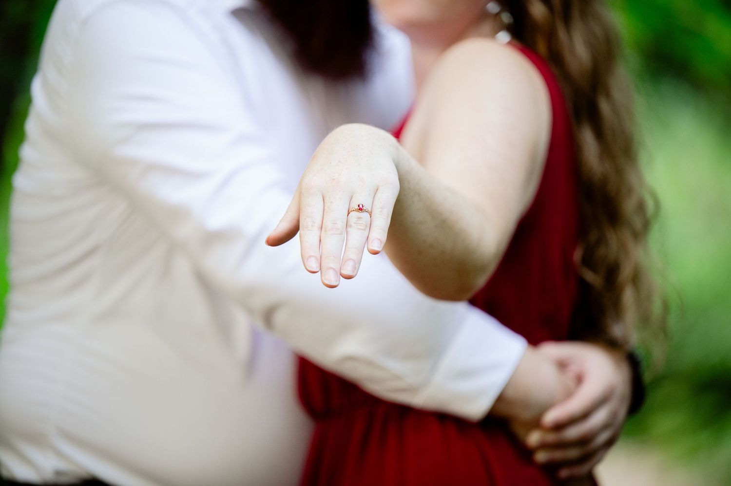 A close-up view of engagement ring photos showcasing different poses and angles with a natural blurred background.