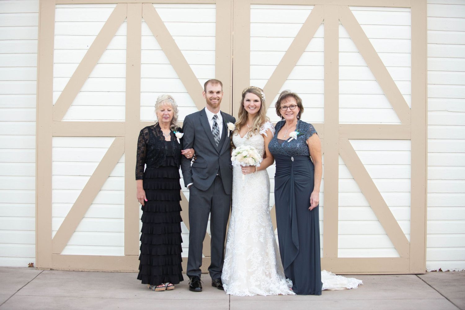 Formal wedding party portrait against geometric barn door background. Milaca Minnesota Weddings