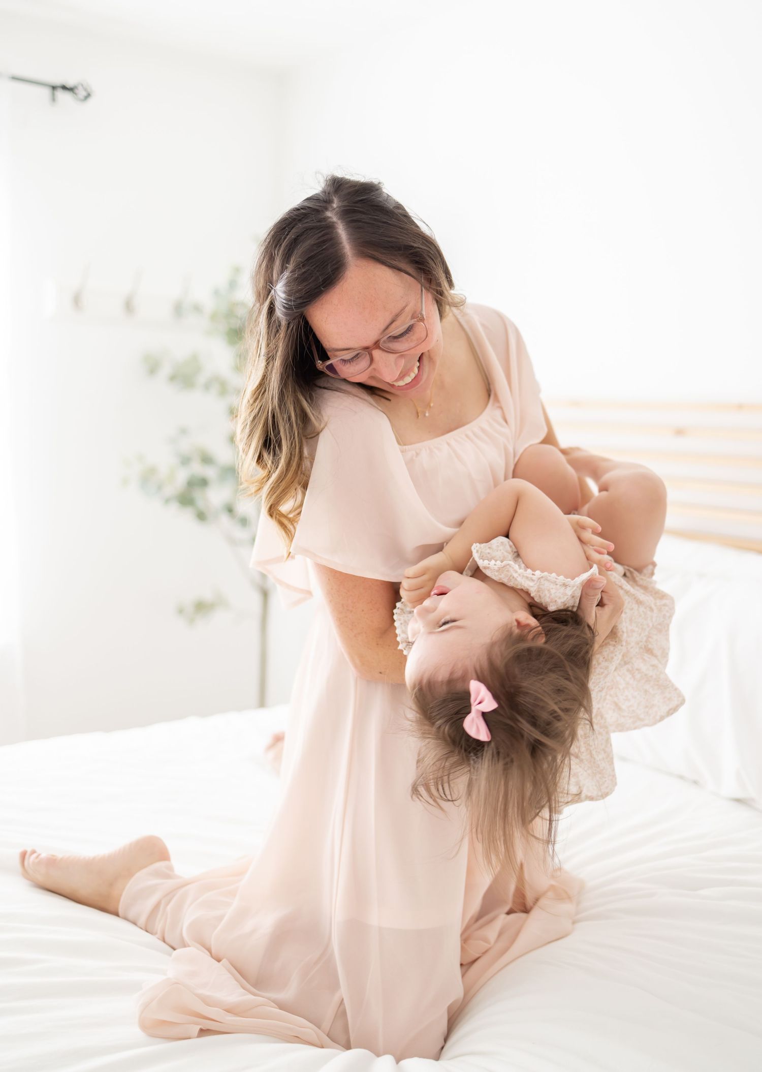 A mom and her daughter share a joyful moment playing together at their mommy and me session in Columbus, GA.