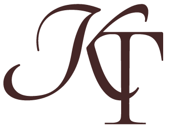 Elegant brown calligraphy letters showing artistic script lettering design against white background.