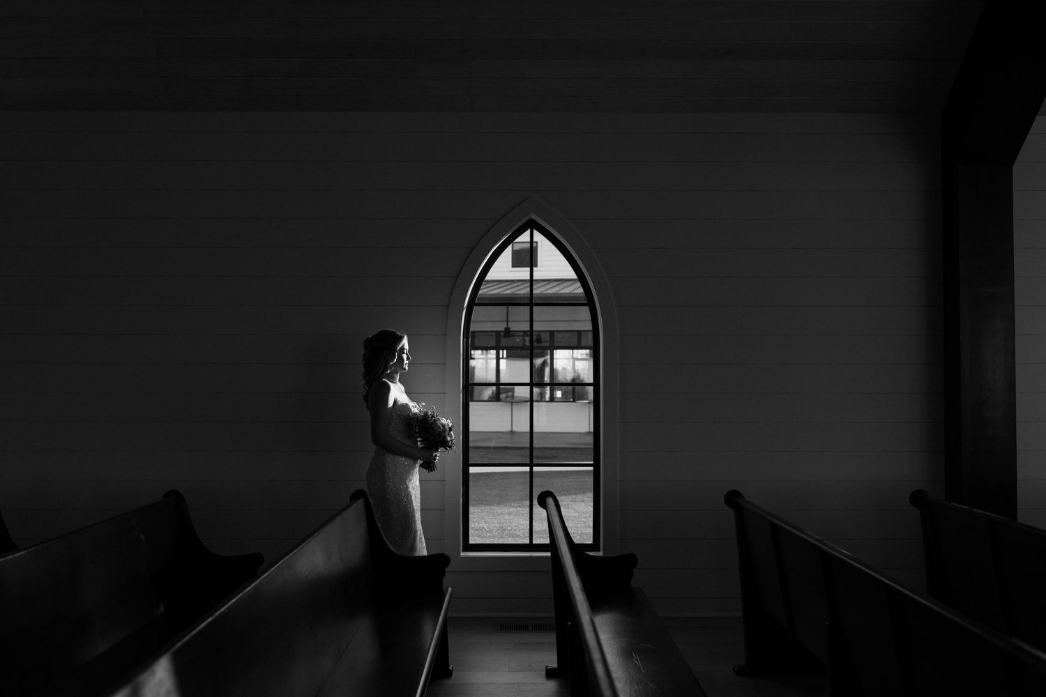 A black and white fine art photo series showing arched windows and dramatic shadows inside an architectural space.