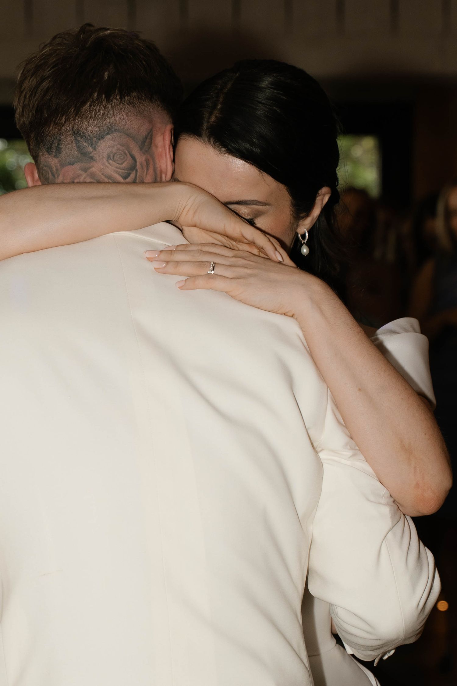 bride cuddles groom close at Primrose Hill farm Wedding- Photo by Primrose Hill Farm Wedding Photographer, Olivia J Morgan Photography