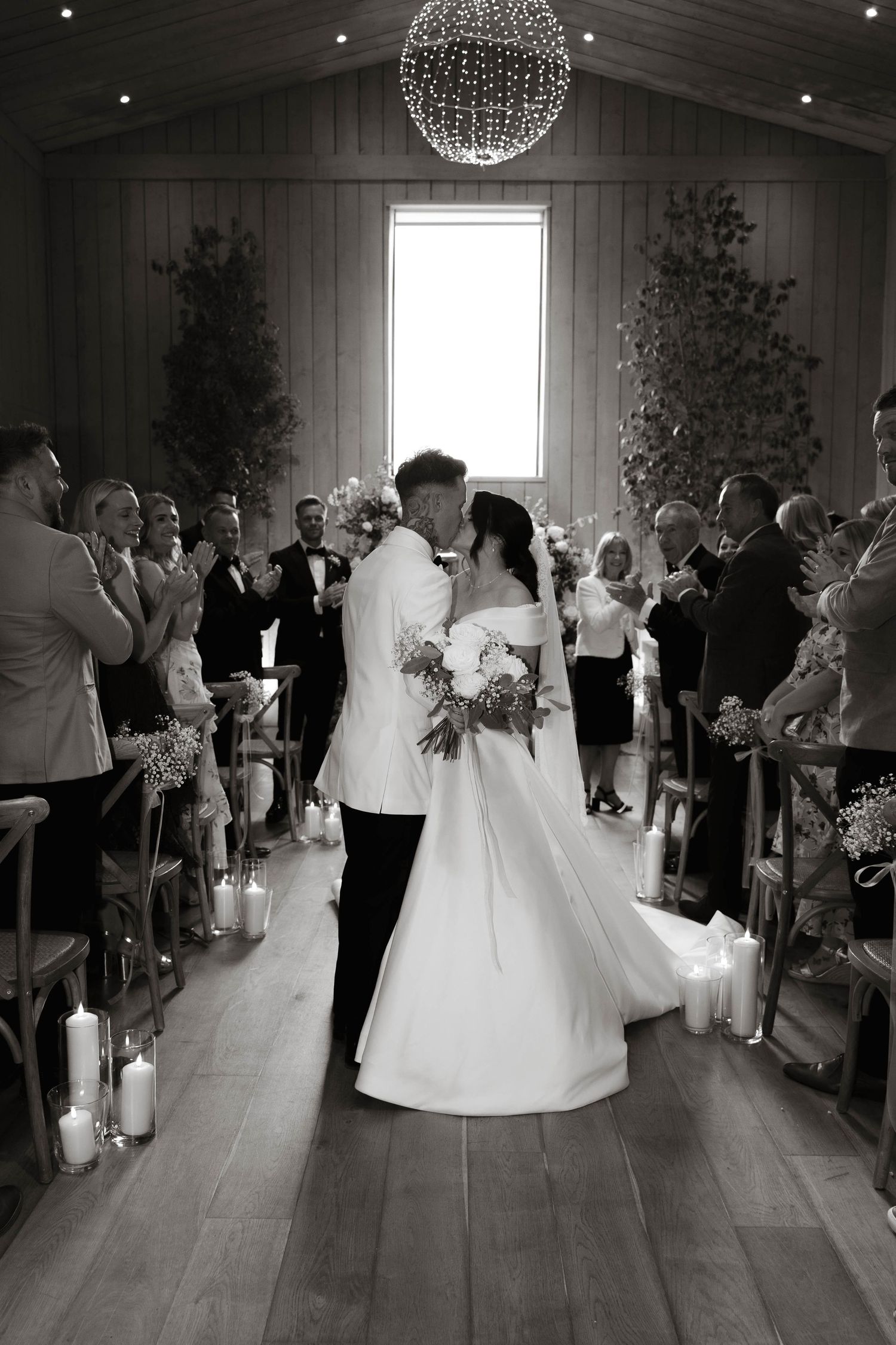 bride and groom kiss in aisle at Primrose Hill farm Wedding- Photo by Primrose Hill Farm Wedding Photographer, Olivia J Morgan Photography