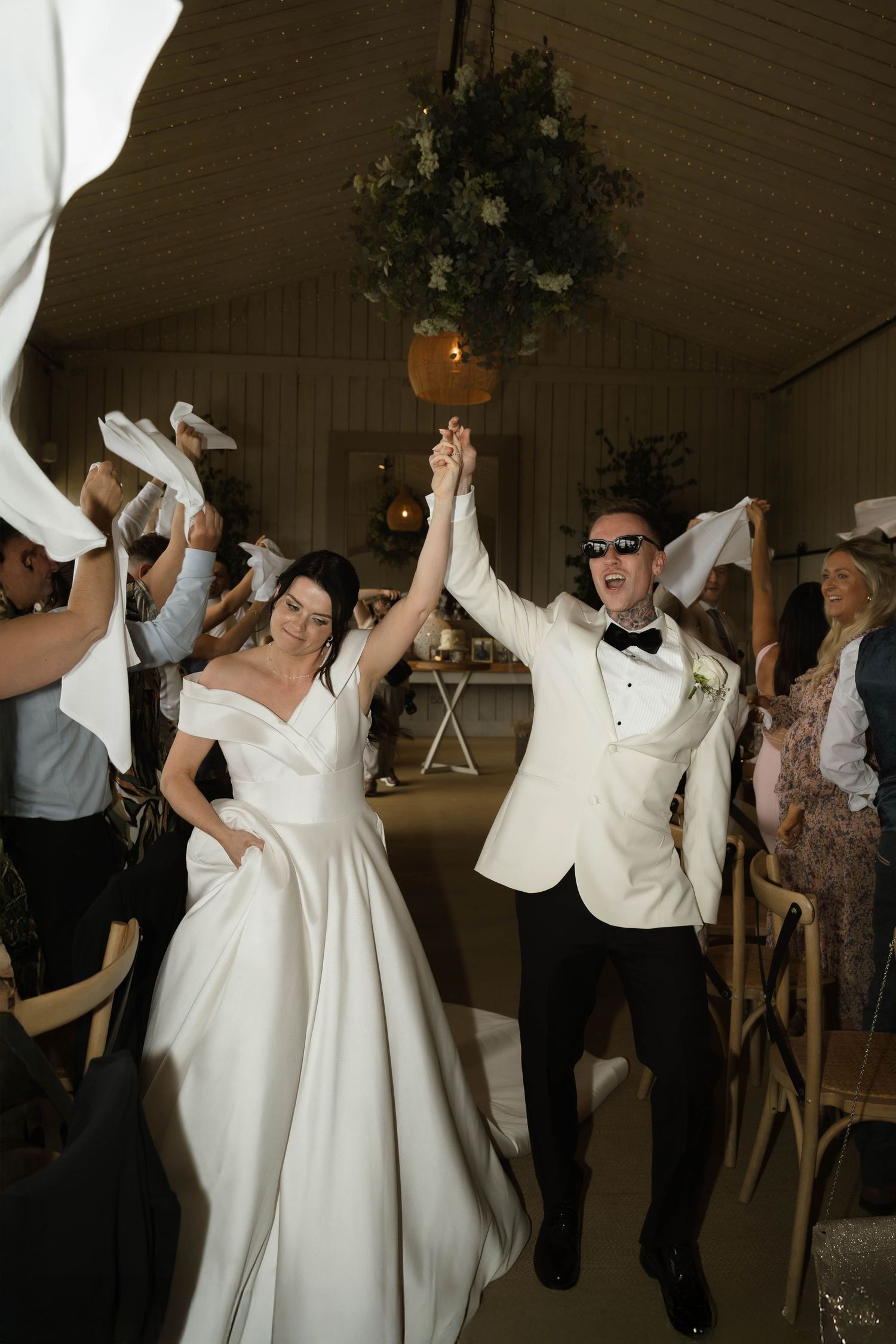 bride and groom enter wedding breakfast at Primrose Hill farm Wedding- Photo by Primrose Hill Farm Wedding Photographer, Olivia J Morgan