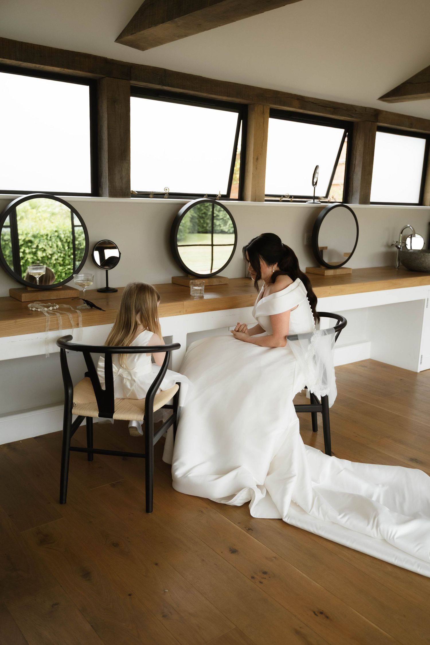 bride and her daughter sit at Primrose Hill farm Wedding- Photo by Primrose Hill Farm Wedding Photographer, Olivia J Morgan Photography