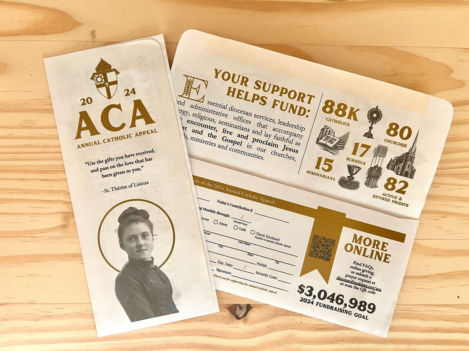 Vintage Catholic organization membership cards and donation forms on wooden surface.
