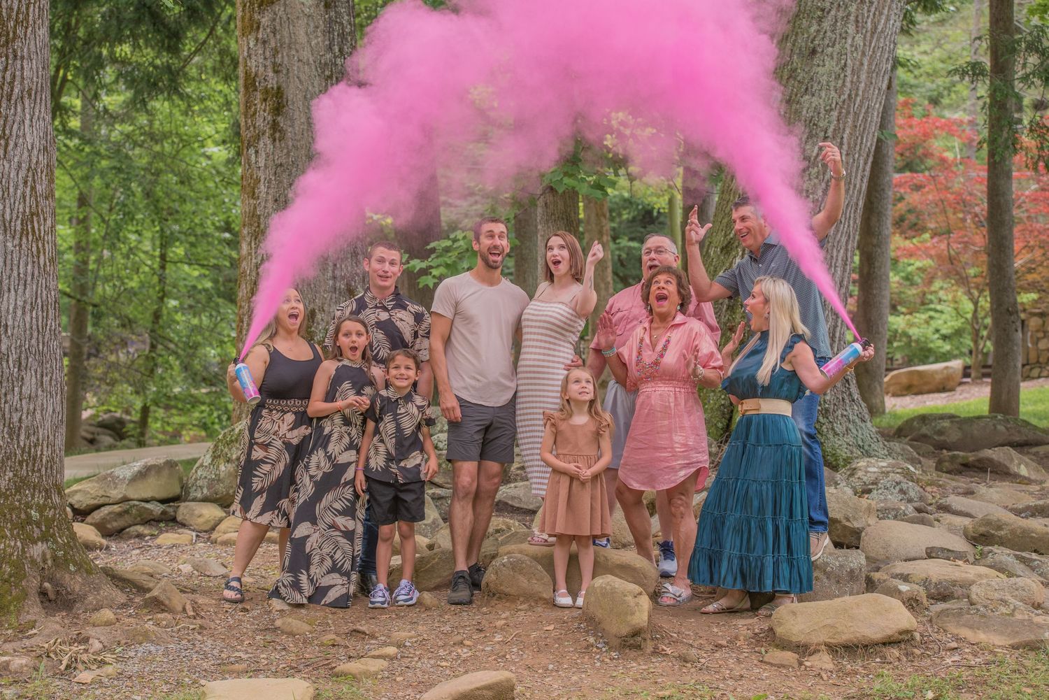 A gender reveal with a family at a park in Gatlinburg TN by Smoky Mountain Portraits by Benjamin.