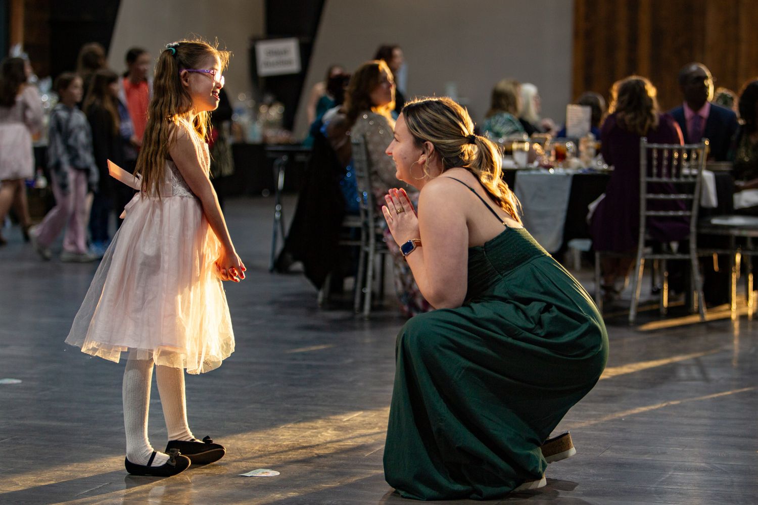 Gigi's Playhouse 2025 Gala event photo down to her level