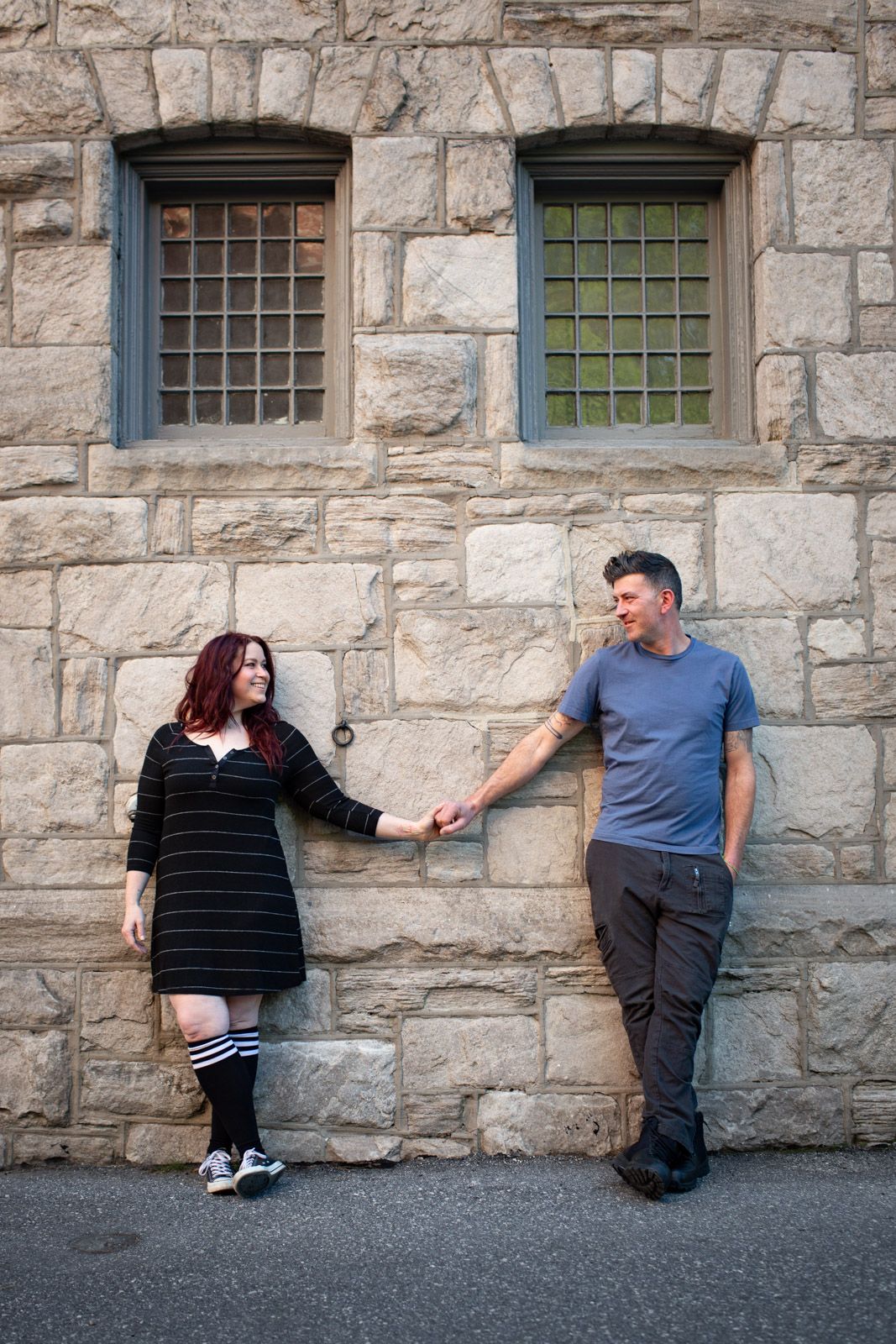 Engaged couple holding hands