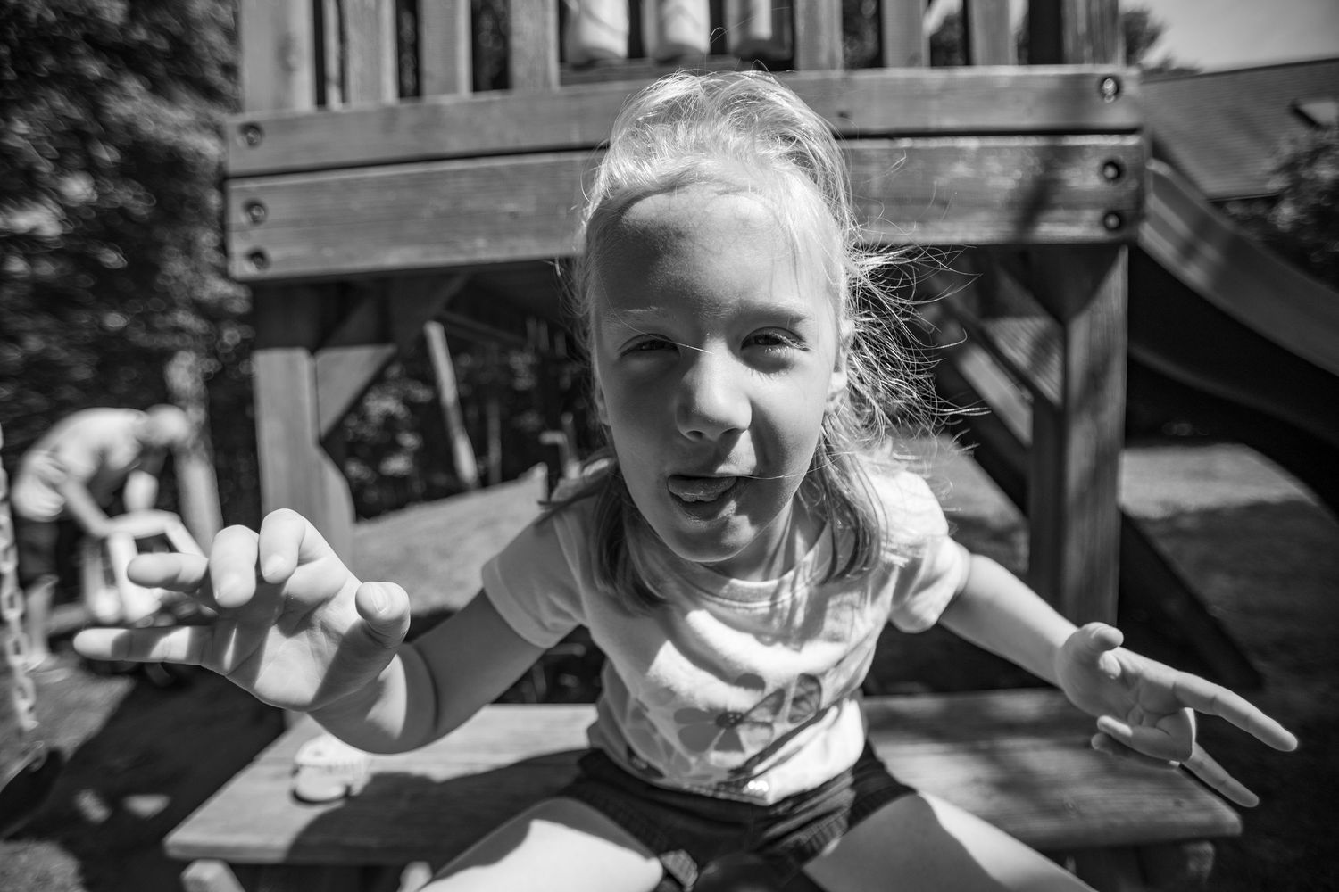 A group of joyful people sharing in celebration outdoors on a sunny day with bright smiles and laughter.