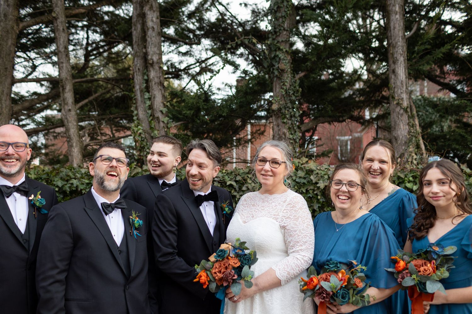 wedding party photo with trees