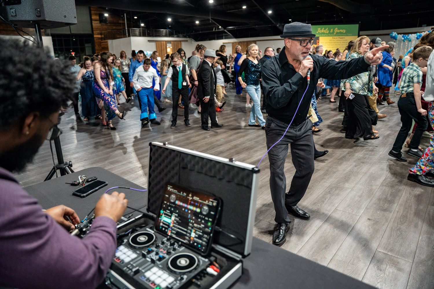 Gigi's Playhouse 2025 Gala event photo DJ on a mike
