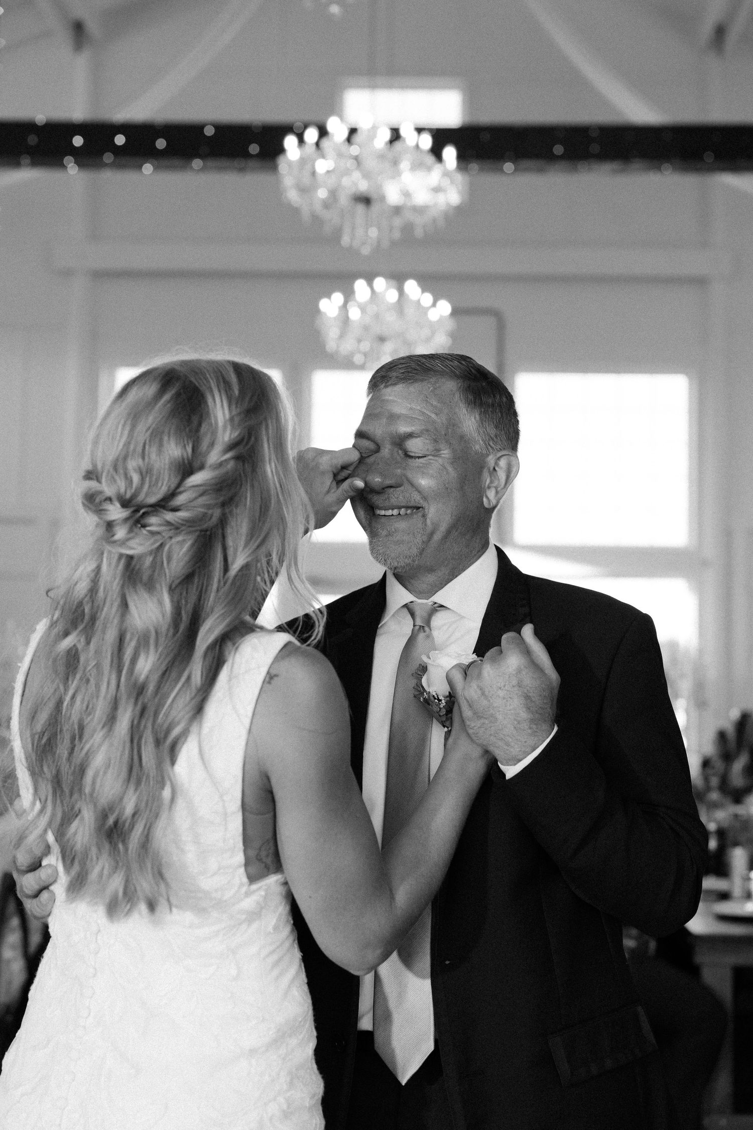 A series of candid moments showing joyful laughter between two people in formal wedding attire.