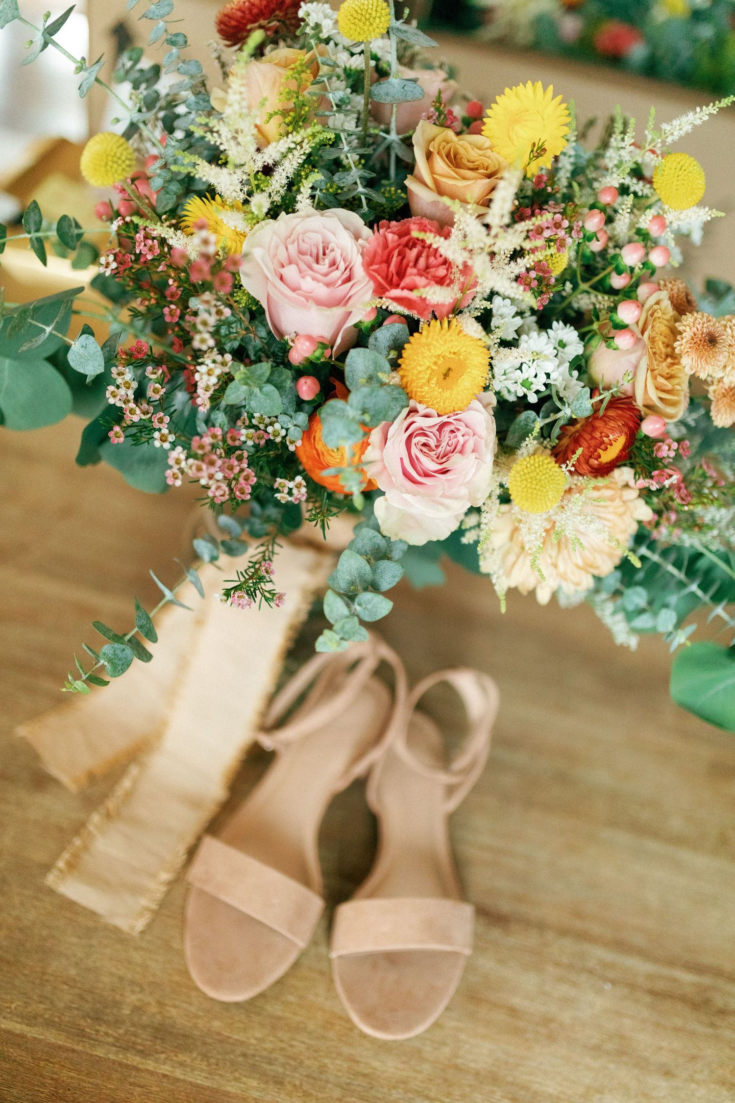 beautiful wedding flowers and bride's shoes